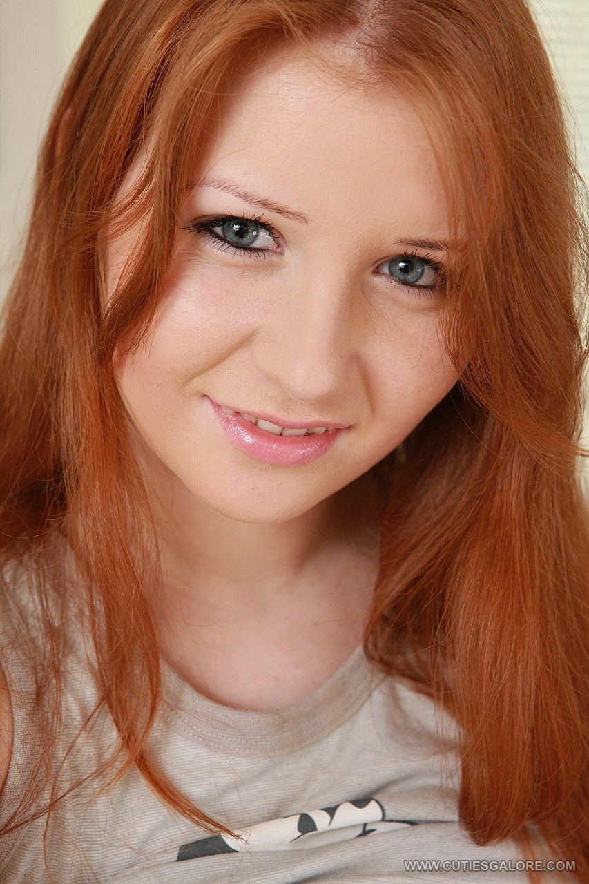Redhead spreading her wet cunt and ass for the camera. photo 5